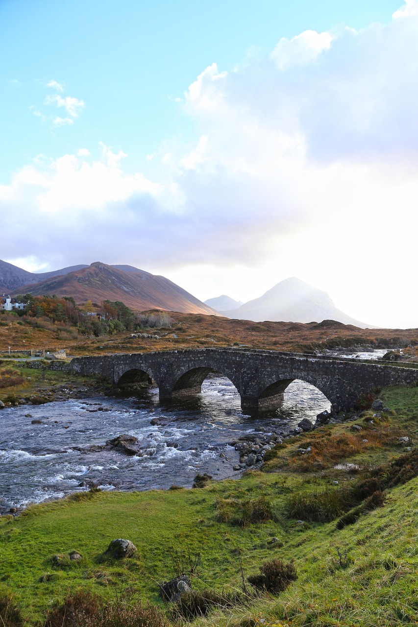 Sligachan Old Bridge, Isle of Skye. Cuillin mountains providing the perfect backdrop to the beautiful Sligachan Bridge seen on the private 3 day Isle of Skye tour from Edinburgh