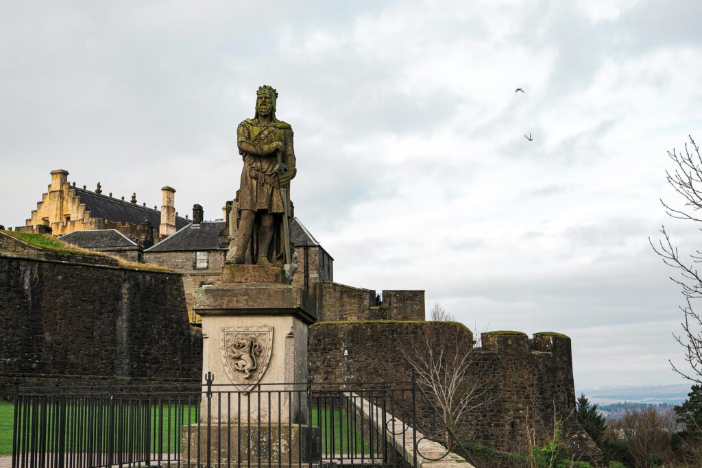 Stirling Castle with a statue of Robert the Bruce on a private day tour from Edinburgh